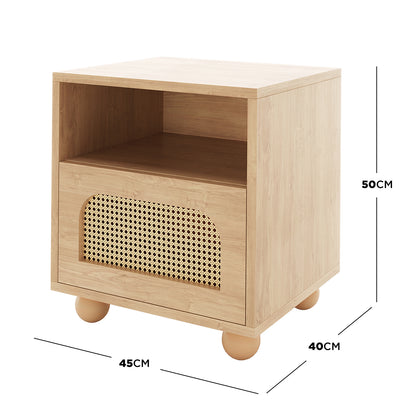 Dialga 45cm Rattan Bedside Table with Storage features a close-up of its woven rattan drawer panel and sturdy steel legs, emphasizing its rustic, elegant design and practical storage solution.