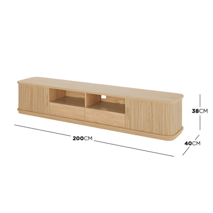 Eddie 200cm Hardwood Oak TV Entertainment Unit in Natural, featuring slatted doors, two center drawers, an open shelf with cable cut-out, and a sleek, modern design for stylish organization.