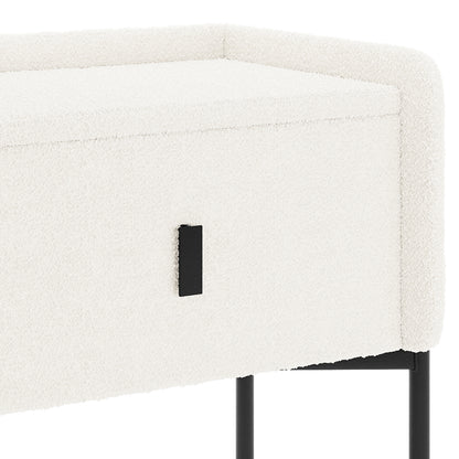 Eliz Boucle Fabric Bedside Table in Cream White features textured upholstery, a sleek black drawer pull, and slender black metal legs, combining elegance with functionality for a modern bedroom aesthetic.