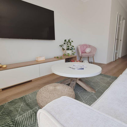 Eloise Entertainment Unit with Shelves - White, featuring adjustable length, open shelves, and push-to-open doors, positioned in a sleek, modern indoor setting suitable for organizing living room essentials.