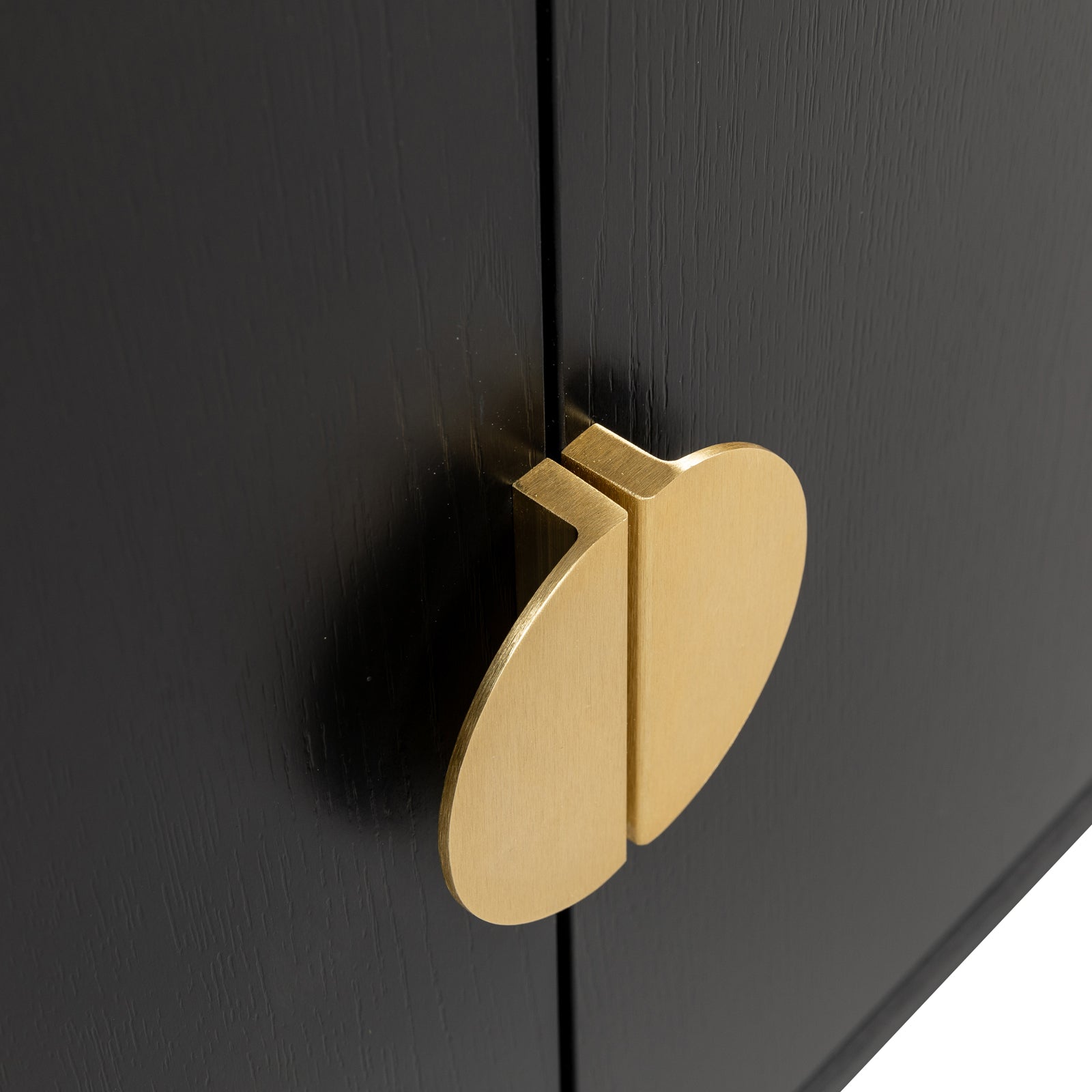 Close-up of Erick 160cm 4-Door Storage Buffet Sideboard in Black, highlighting brass-finished cabinet pulls on black wood doors, showcasing sleek, modern design and push-to-open functionality.
