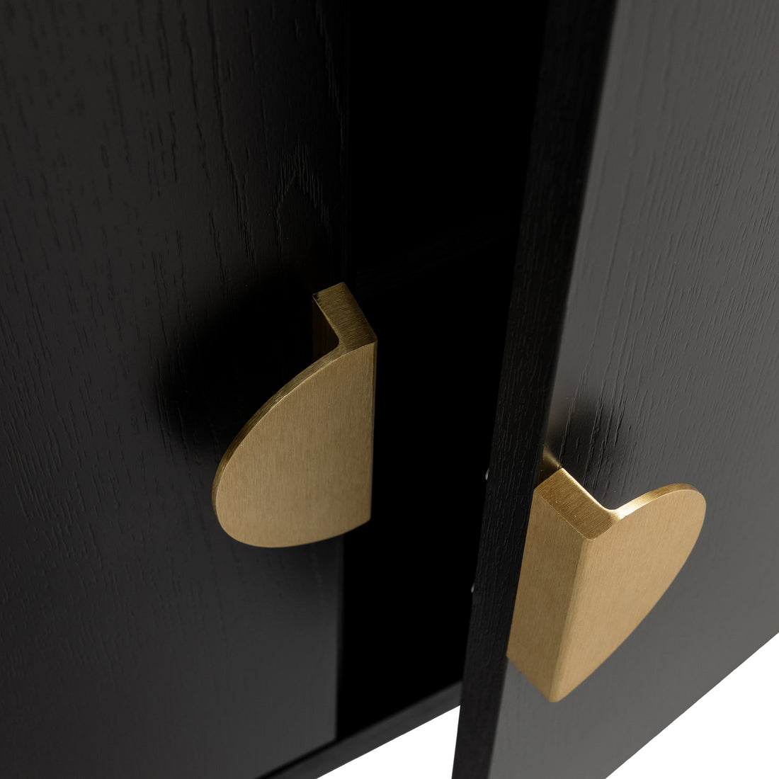 Erick 160cm 4-Door Storage Buffet Sideboard in Black features slightly ajar black wooden doors with teardrop-shaped brass pulls, revealing a dark interior, exuding modern elegance and functionality.