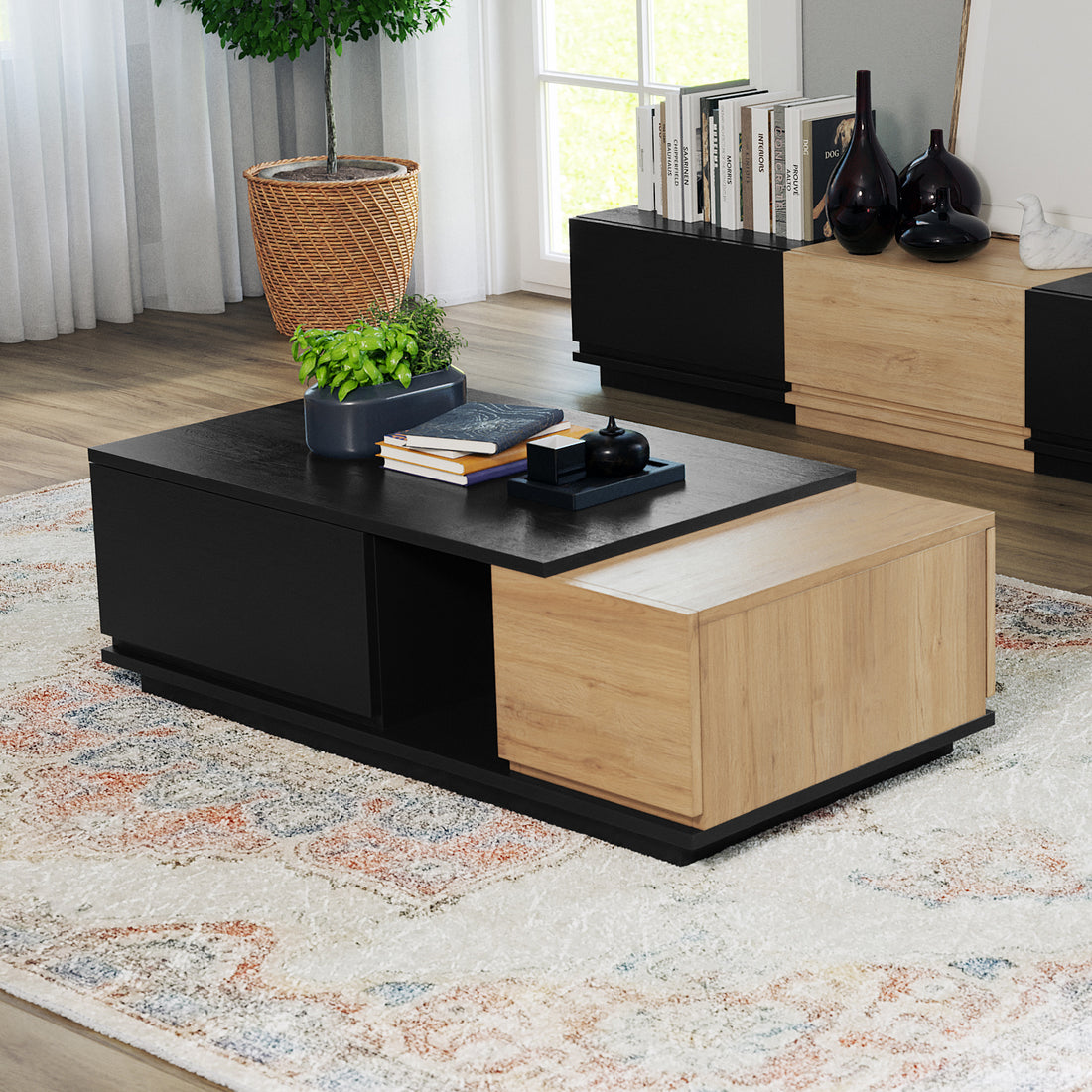 Freda 120cm Coffee Table with Storage in Black & Natural features a dual-tone design with a shallow planter, books, and decor atop, complemented by a matching sideboard and ambient room elements.