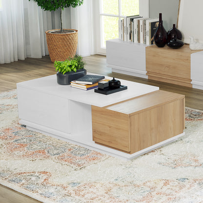 Freda 120cm Coffee Table with Storage in White & Natural, featuring a white top, warm wood accents, black planter, books, and a black tray, set on a patterned cream rug.