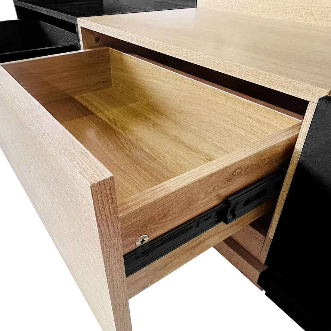 Close-up of the Freda 120cm Coffee Table with Storage, showing a partially opened light-wood grain drawer with black metal slides, integrated into a darker-finished cabinet. The drawer is empty.