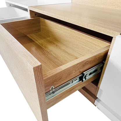 Freda 120cm Coffee Table with Storage features a light oak-finish drawer on metal slides, part of a two-tone wood-and-white cabinet, highlighting its elegant and functional design.