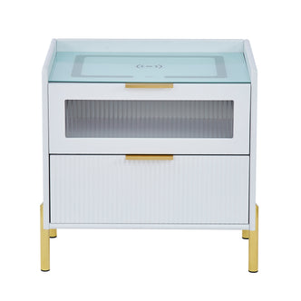 Gwen Smart Bedside Table with Wireless Charger in White, featuring two drawers with glass and ribbed fronts, gold-tone handles and legs, a glass top with Qi wireless charging pad.