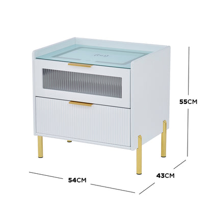 Gwen Smart Bedside Table with Wireless Charger in White, featuring a white finish, gold-plated legs, two drawers with ribbed semi-transparent front, glass top with wireless charging symbol, measuring 54x43x55 cm.
