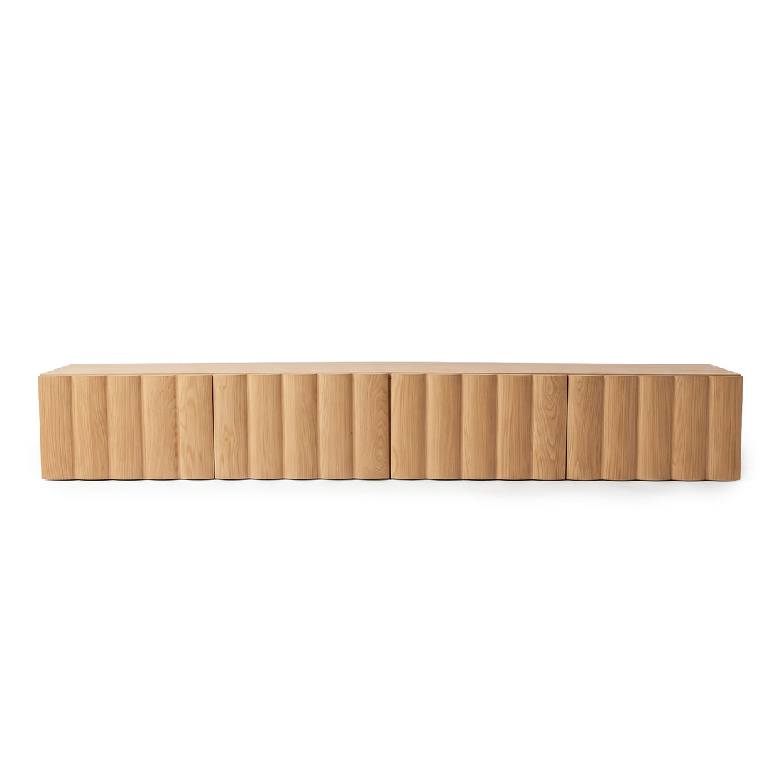 Oak TV unit featuring vertical fluted front panels against a plain white studio background.