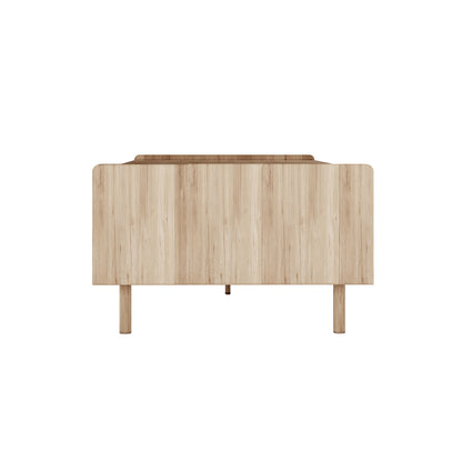 Hayden 130cm Fluted Coffee Table with Storage in Natural, featuring a minimalist design with a smooth front panel, cylindrical wooden legs, and a sliding door for concealed storage.