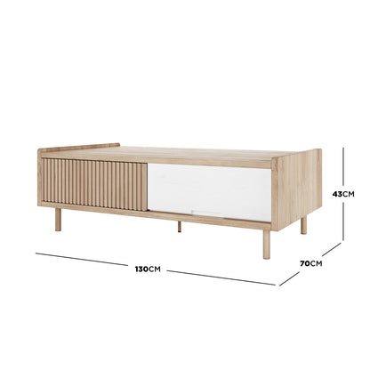 Hayden 130cm Fluted Coffee Table with Storage in Natural, showcasing light oak wood, smooth white sliding door, and sleek metal legs. Dimensions: 130cm width, 70cm depth, 43cm height.