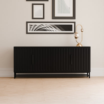 Holly 180cm 4-Door Storage Buffet Sideboard in Black, featuring vertical slatted doors and recessed handles, paired with a sculptural lamp and abstract prints, creating a sleek, modern vignette.