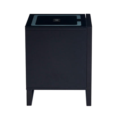 Isha Smart Bedside Table with Wireless Charger in Black, featuring a cube design with four short legs and a charging icon on the tabletop, emphasizing modern convenience and style.