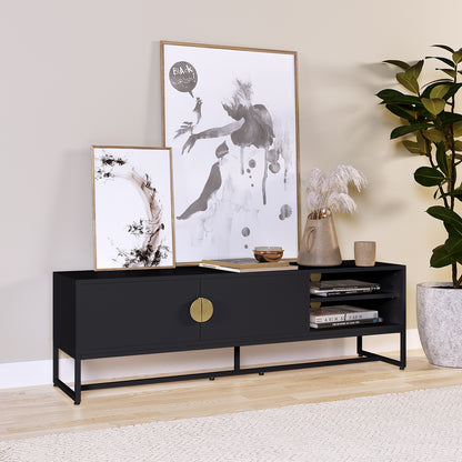 The Landon 160cm TV Entertainment Unit - Black features a black metal frame, oversized brass-tone pulls, and open shelving, elegantly styled with books, art, and decor accents.
