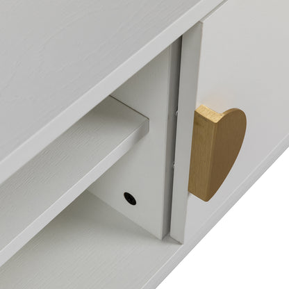 Close-up of the Landon 160cm TV Entertainment Unit - White, showcasing a white wooden shelf with a gold heart-shaped pull handle on the hinged door, highlighting its modern design.