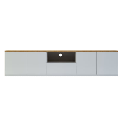 Leslie 180cm Floating Entertainment Unit in White & Natural featuring a modern design with a wood-tone top, white base, four handleless doors, central open cubby, and cable-management hole.