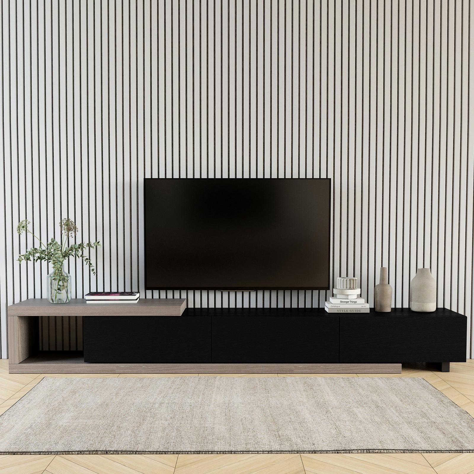 Mable Extendable Entertainment Unit with Drawers - Black: Modern low console in light wood and black; features three drawers, open shelf, and adjustable length, styled with books and vases.