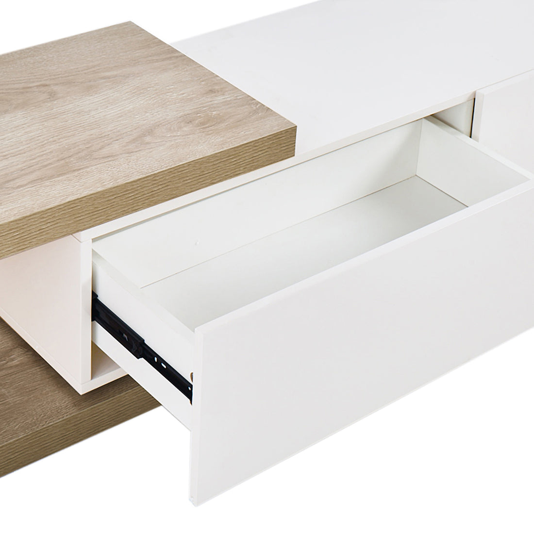Mable Extendable Entertainment Unit with Drawers White features a close-up of a partially open white drawer on metal glides, topped with a light oak–veneered panel, showcasing its modern design.