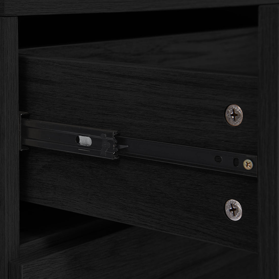 Close-up of Manuel 2 Drawer Storage Bedside Table Black, showing a side-mounted metal drawer slide attached to a dark-stained wooden case with black steel rail and large Phillips-head screws.