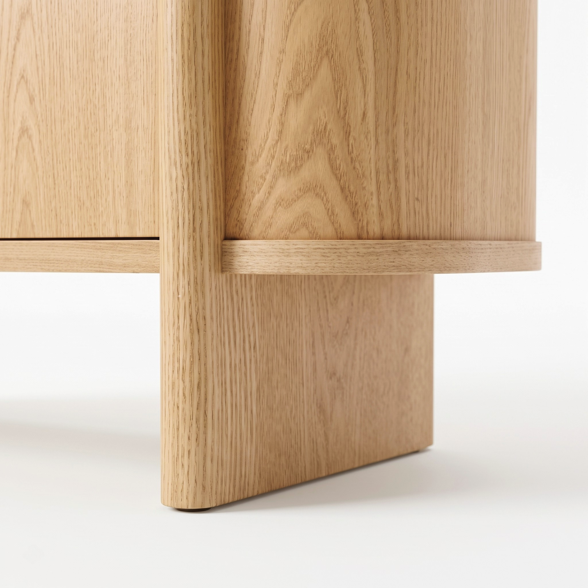 Close-up of the lower section of a light wood cabinet