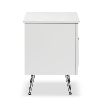Matteau 46cm Bedside Table with Glass Door in White, featuring a sleek, boxy design with chrome-finished tapered legs and an elegant arched fluted glass door for stylish, modern bedroom storage.