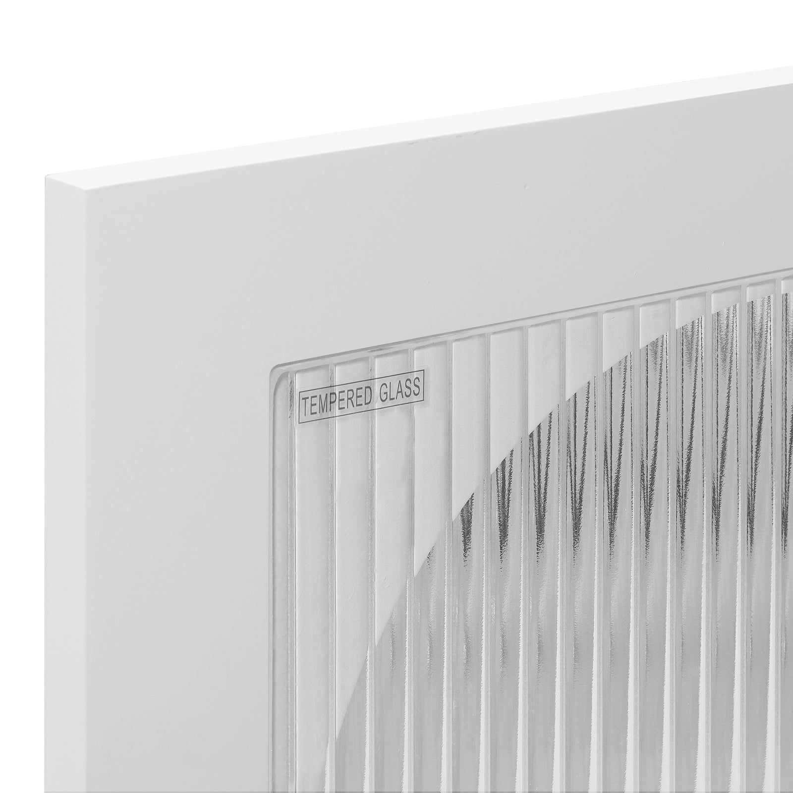 Close-up of the Matteau 46cm Bedside Table with Glass Door in White, showcasing its vertical-fluted tempered glass pane within a sleek white frame, labeled TEMPERED GLASS in the corner.