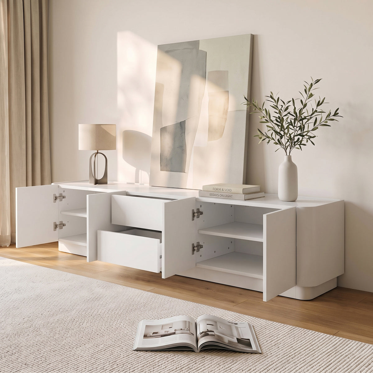 White sideboard styled in a modern living room with decor