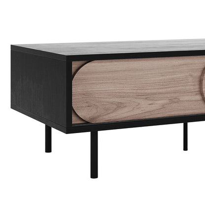 Novia 120cm Coffee Table with Sliding Doors features a sleek black frame, light wood sliding doors, and slim metal legs, embodying minimalist design with practical, divided storage compartments for a chic living room upgrade.