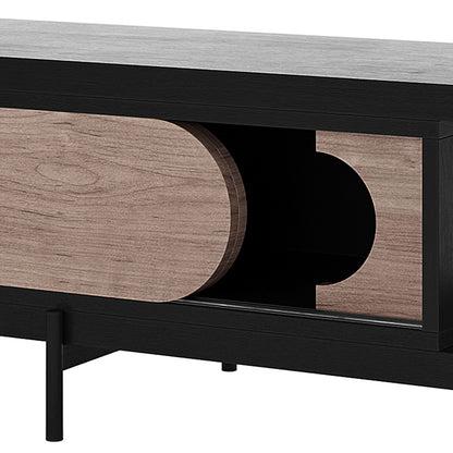 Novia 220-270cm Extendable Entertainment TV Unit in Black features a sleek design with black-stained case, slender legs, and light wood sliding panels creating an oval opening for versatile storage.