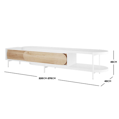 Novia 220-270cm Extendable Entertainment TV Unit in White with a low-profile design, white frame, natural-wood sliding doors, on slim legs, featuring open shelving and concealed compartments.