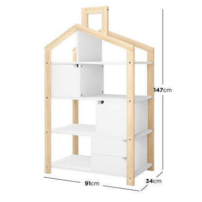 Quinta Shelf Unit with Storage features a light-wood, house-shaped design with three open shelves, two cubby-style drawers, and a peaked roof frame, offering practical and playful organization for a child's room.