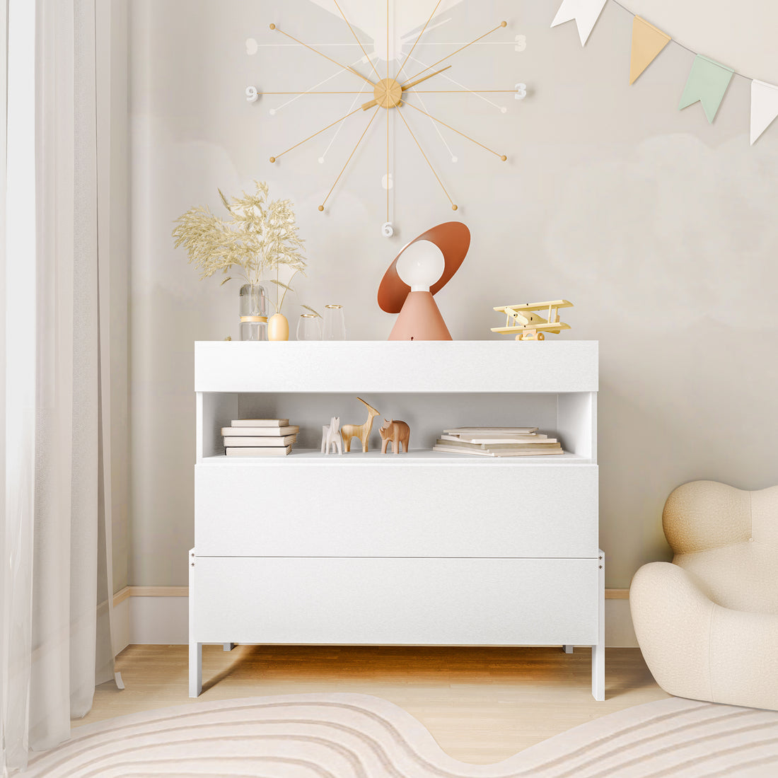 Quinta Tallboy Dresser with Drawers White featuring a low white cabinet with two deep drawers, an open shelf holding books and figurines, topped with decorative vases, a lamp, and a toy biplane.