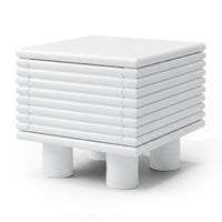White modern side table with ribbed texture on a white background
