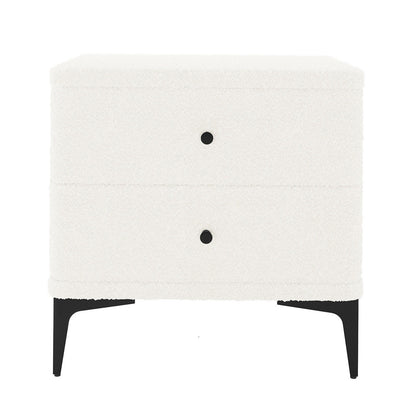 Shona Upholstered Boucle Bedside Table in Cream White, featuring two drawers with black knobs, upholstered in off-white bouclé fabric, on slender black metal legs, blending modern elegance and functionality.