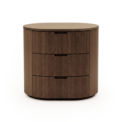 Wooden three-drawer chest on a white background