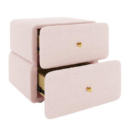 Tyla Upholstered Boucle Bedside Table in Light Pink, featuring two partially open drawers with brass knobs, wrapped in textured bouclé fabric, showing unfinished wood interiors, offering elegant bedroom storage.