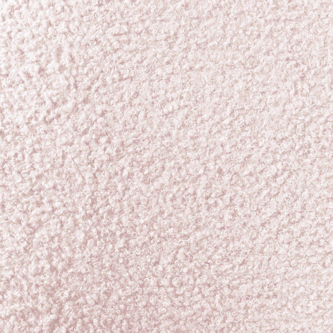 Tyla Boucle Upholstered Bedside Table features a close-up of light pink boucle fabric, showcasing its plush, nubby texture with tightly packed looped fibers, highlighting its soft sophistication and modern elegance.