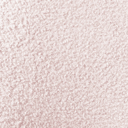 Tyla Boucle Upholstered Bedside Table features a close-up of light pink boucle fabric, showcasing its plush, nubby texture with tightly packed looped fibers, highlighting its soft sophistication and modern elegance.