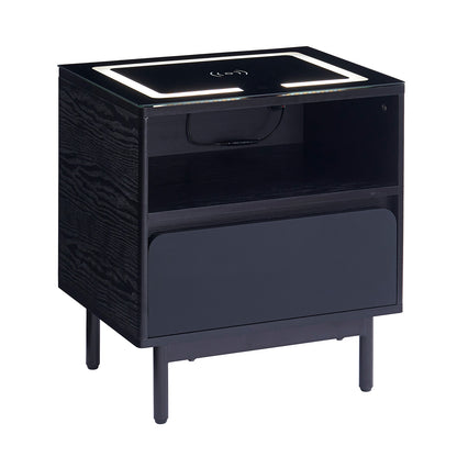 Zayn Smart Bedside Table with Wireless Charger in Black, featuring a sleek design with an open cubby, single drawer, built-in wireless charging pad, and LED-lit top surface on slender legs.