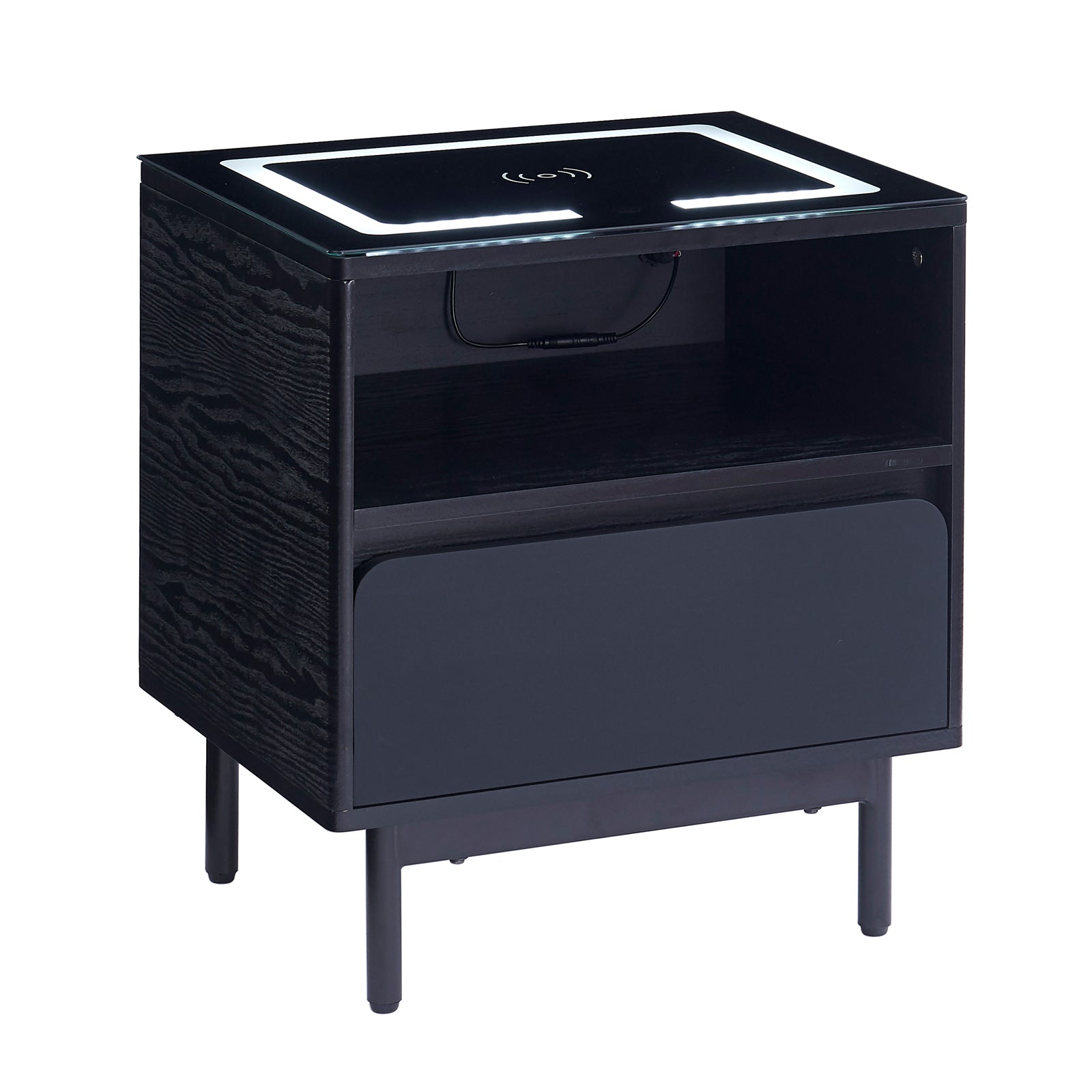 Zayn Smart Bedside Table with Wireless Charger in Black, featuring a matte-black finish, slender metal legs, open cubby, pull-out drawer, tempered-glass top with LED lights, and Qi charging symbol.