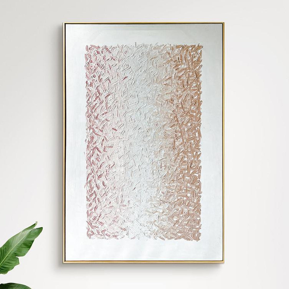 The Amelia 100x150cm Framed Textured Canvas 3D Wall Art features a gold frame and abstract brushstrokes, transitioning from rose-pink to champagne-gold, adding elegance and depth to any room.