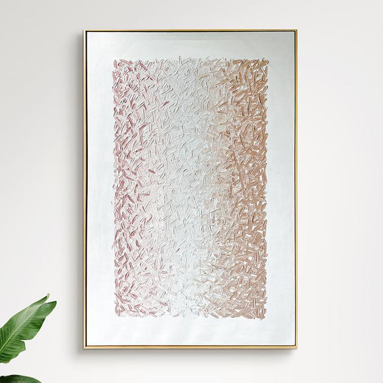 The Amelia 100x150cm Framed Textured Canvas 3D Wall Art features a gold frame and abstract brushstrokes, transitioning from rose-pink to champagne-gold, adding elegance and depth to any room.
