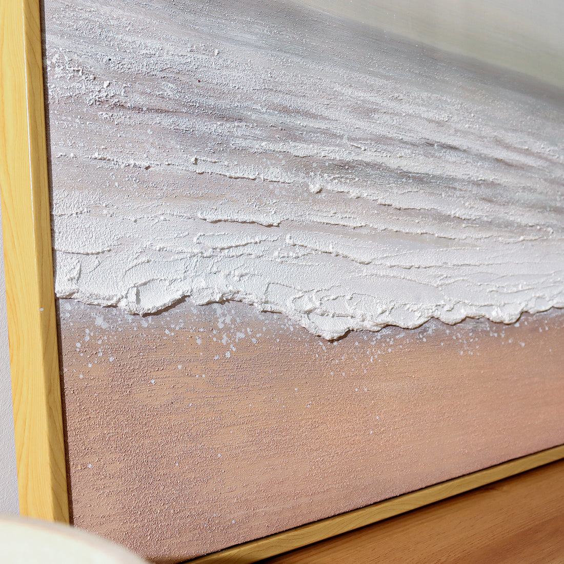 Sable Textured Coastal Canvas Wall Art displayed in a modern living room, showcasing its serene coastal aesthetic and how it enhances a beach-inspired or minimalist interior.