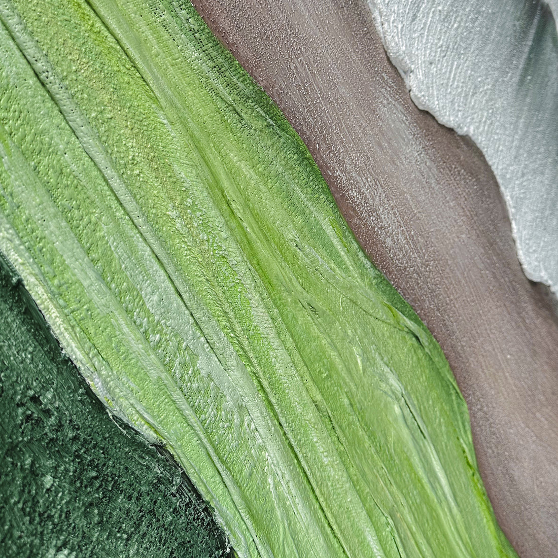Close up of Sweeney Modern Framed Textured Canvas Wall Art, revealing intricate hand-painted details, pronounced 3D textures, and the blend of soft green, brown, and grey tones in the abstract natural design.