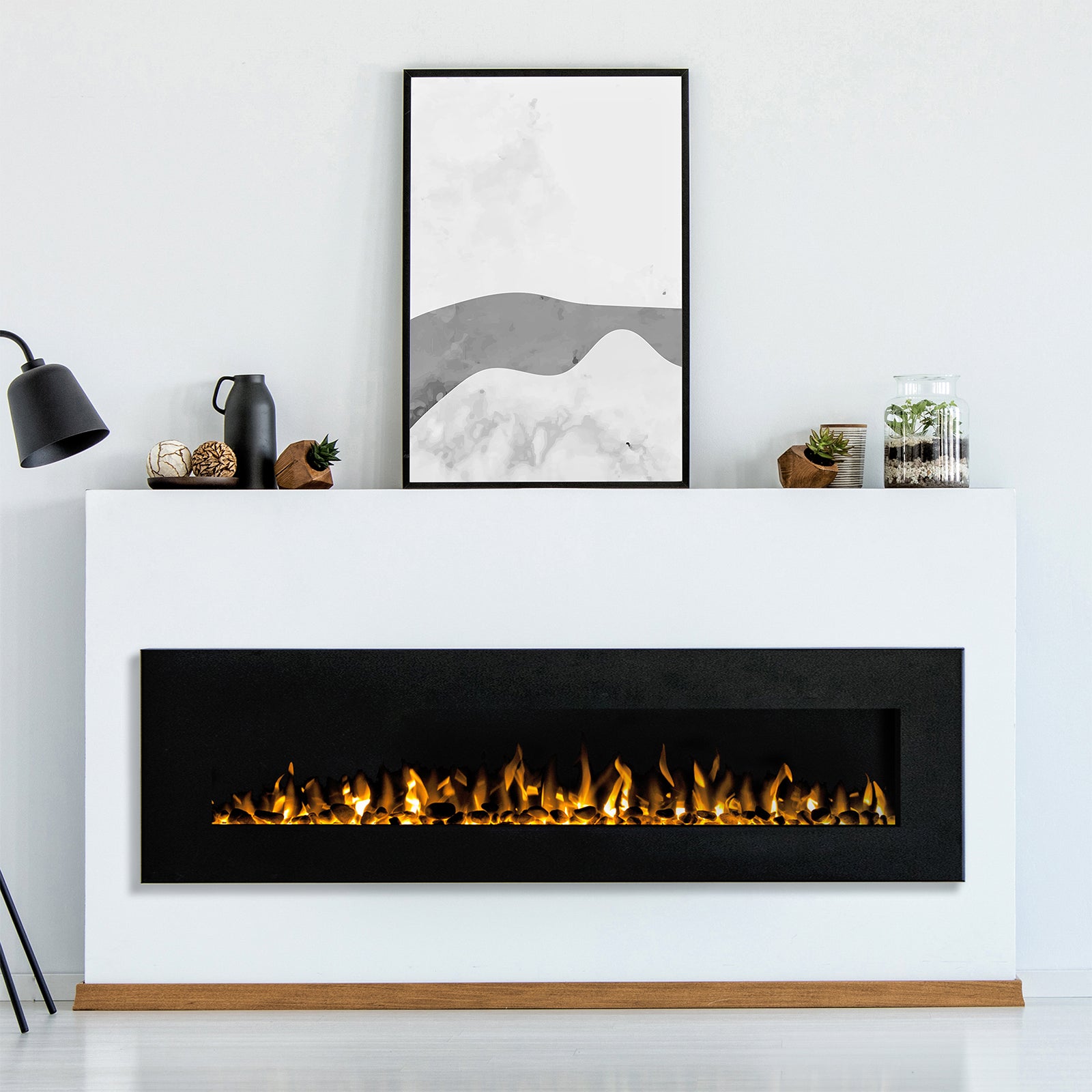 Dakota 60 Wall Mounted 1500W Electric Fireplace Heater Black centered in a modern living room, set into a white mantelpiece with glowing flames, surrounded by minimalistic decor like a black vase and abstract print.