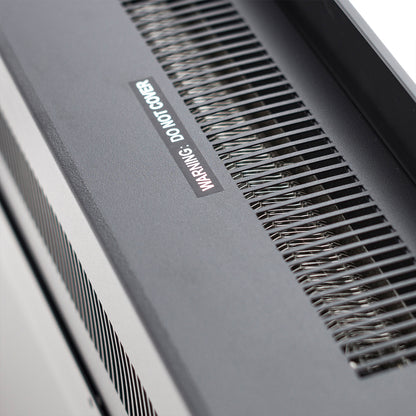 Close-up of the Dakota 60 Wall Mounted 1500W Electric Fireplace Heater showing its vented metal housing with slotted air grille, exposed heating coils, and “WARNING: DO NOT COVER” label.