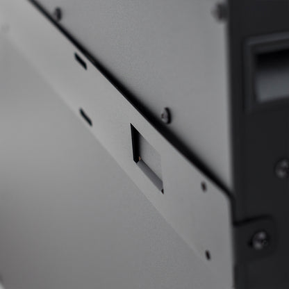 Close-up of Dakota 60 Wall Mounted 1500W Electric Fireplace Heater, showcasing a textured gray steel panel with a central latch and black screws, emphasizing its sleek, space-saving design.