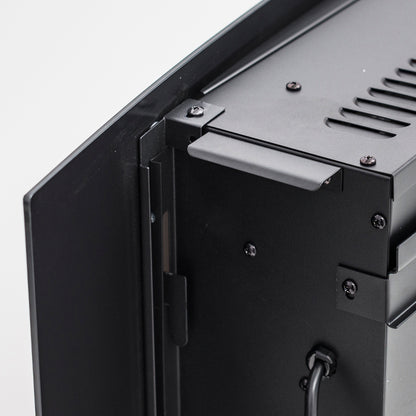 Close-up of the Wyoming 90cm Free Standing LED Electric Fireplace in Black, showcasing the black powder-coated metal enclosure with hinged flap, mounting bracket, vent slots, screws, and power cable.
