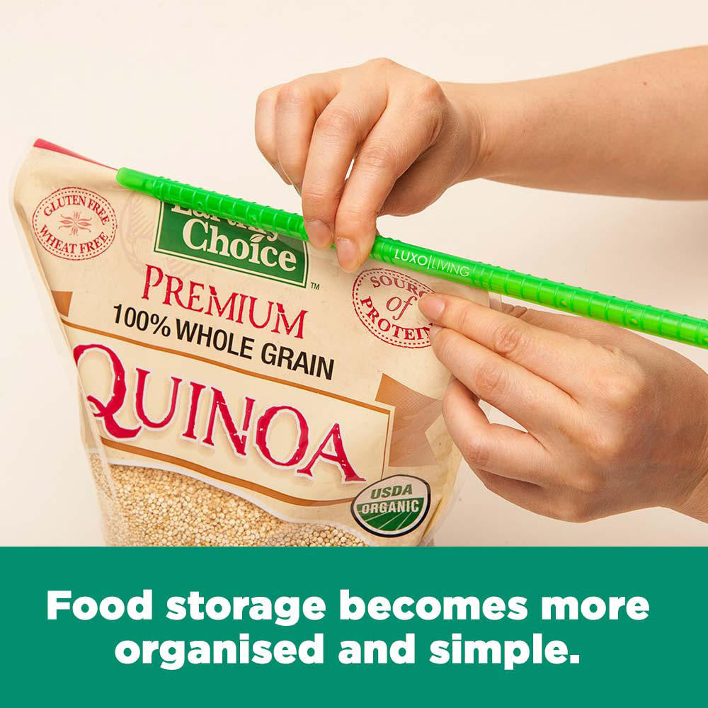 Hands sealing a bag of Premium 100% Whole Grain Quinoa with a green LUXO LIVING sealer, showcasing the 10pcs Kitchen Sealing Stick Reusable Clips Bag Sealer's function in maintaining freshness and organization.