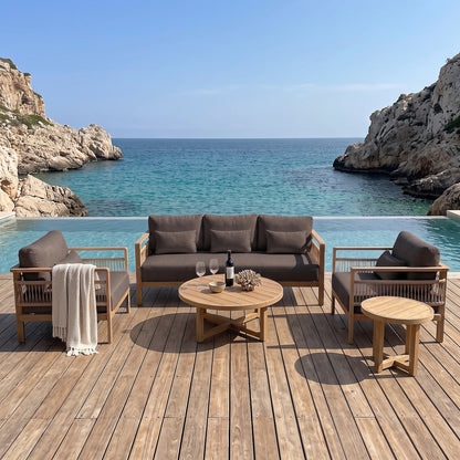 Outdoor furniture set arranged on a deck overlooking the ocean